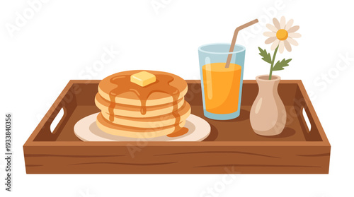 Breakfast in bed tray with pancakes and refreshing orange juice