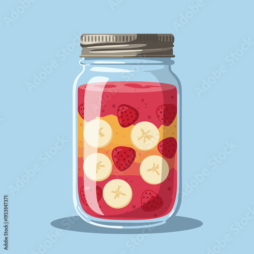 Colorful fruit jar filled with layers of strawberries and bananas against a blue background