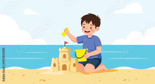 Happy young boy kneeling on a sunny beach builds a detailed sandcastle with a bucket, spade, and a little red flag.