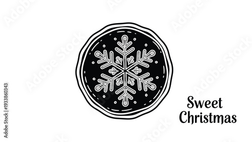 Single round black Christmas cookie decorated with an intricate white snowflake icing pattern on a plain white background.