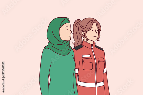 International Women's Day diversity concept featuring rescue worker and woman in hijab to celebrate March 8 professional equality and intersectional feminism