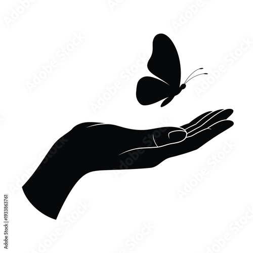 A black silhouette of a butterfly resting on an open human hand