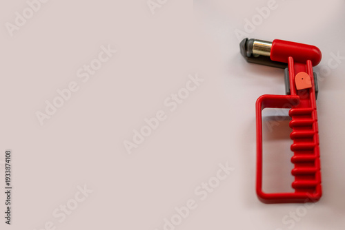 Schilderij op canvas Red emergency glass breaker tool, safety hammer for car windows, rescue equipmen