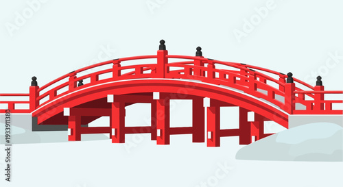 Red Japanese Arch Bridge Over Snow and Ice