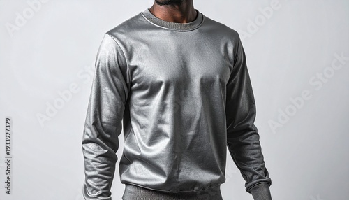 Sleek Metallic Sweater: A man models a contemporary silver metallic sweater with long sleeves, offering a modern and stylish aesthetic.