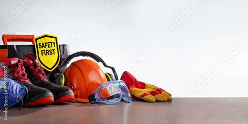 Work safety protection equipment on grey background with copy space. Horizontal banner.