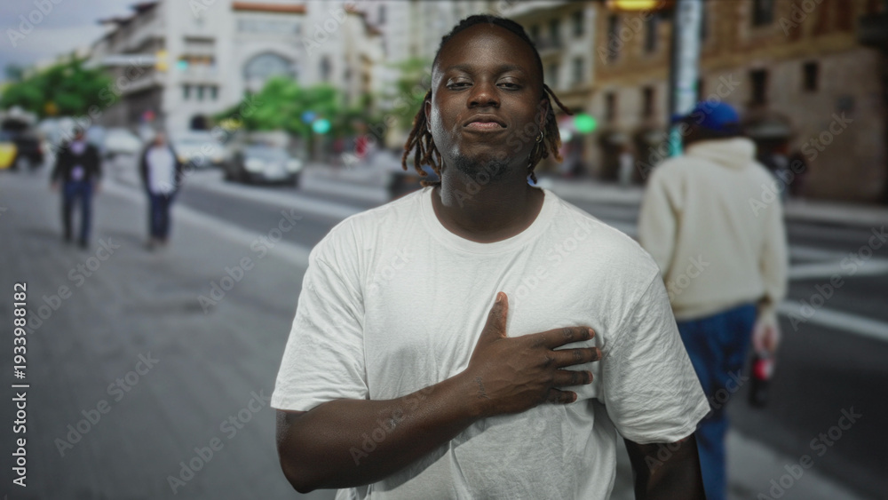 Fototapeta premium Man clutching chest on city street, hand pressed over heart in visible pain sign of heartattack; urgent help anxiety.