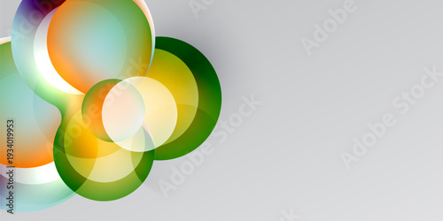 Abstract design features overlapping colorful circles. Gradient shades blend into dark, light gray background. Modern, vibrant composition.