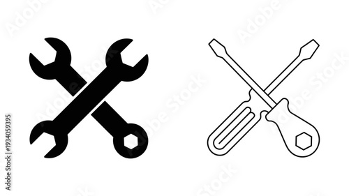 Two essential hand tools, a wrench and a screwdriver, are crossed, symbolizing repair and maintenance.