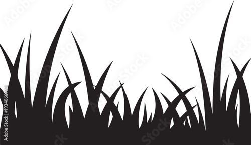 Black silhouette of grass blades on white background