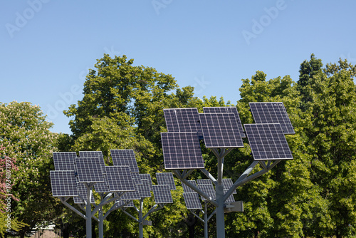 Wooden benches and solar panels in city park in Warsaw, Poland.