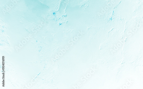 Texture of light blue decorative plaster or concrete with vignette. Abstract grunge background for design.