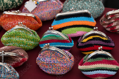 Handmade knitted ethnic wallets on the market