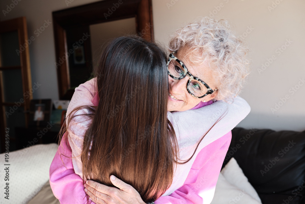 Fototapeta premium close up shot of Grandmother embracing granddaughter sharing love and family bond