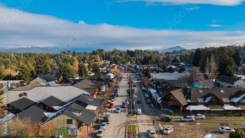 Schilderij op canvas Aerial view of main street in Villa La Angostura with alpine architecture and Andes mountains in Patagonia, Argentina