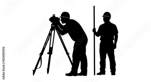 Two construction workers operate survey equipment on a site outdoors