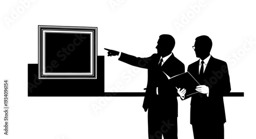 Two businessmen in suits discuss and point at a presentation on screen