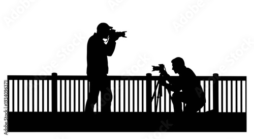 Two photographers taking pictures from a balcony with railings