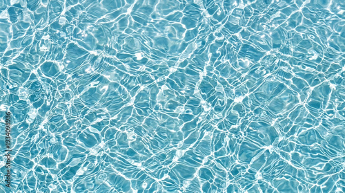 Top-down view of light blue pool with white undulating water refraction lines forming organic patterns.