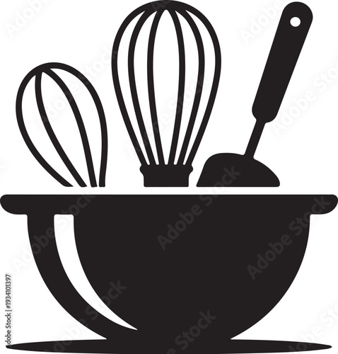 Black bowl with whisk and spatula kitchen cooking