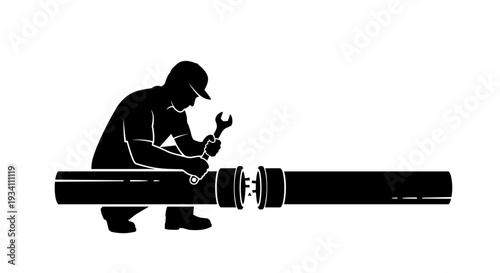 Man Working on Large Pipe Fitting.