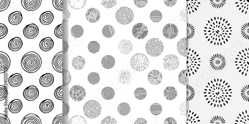 Abstract patterns featuring spirals dots and radial bursts in grayscale