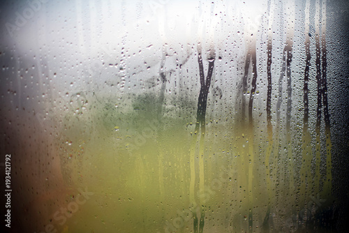 Foggy wet window with raindrops