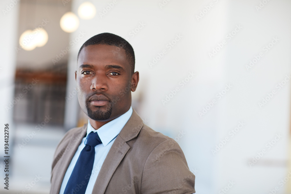 Fototapeta premium Serious, corporate and black man with portrait in office for career pride, about us and accountant. Space, male person and finance consultant with ambition, professional employee and investment firm
