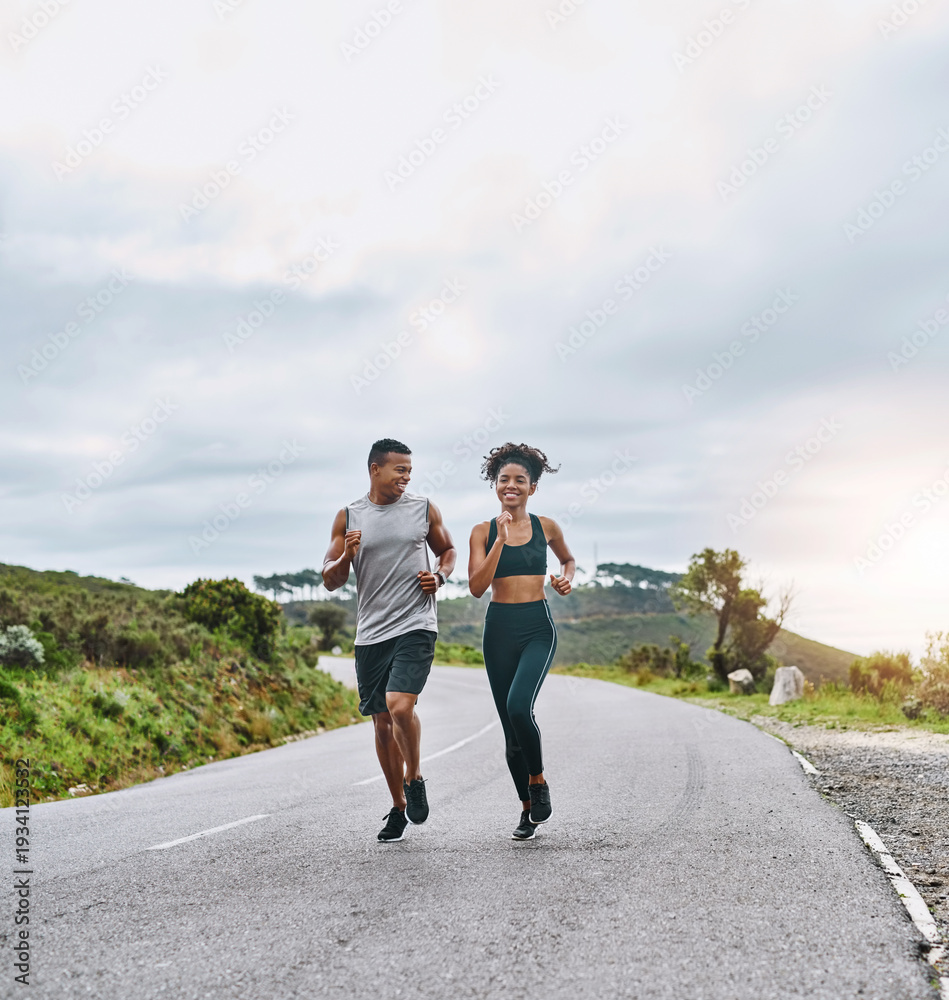 Obraz premium Fitness, couple and happy with running in road for marathon practice, pace training and cardio support. Space, african people and jogging outdoor for exercise challenge, sport performance and bonding