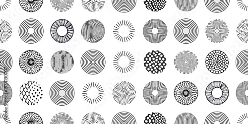 Abstract arrangement of circular patterns in black and white illustration