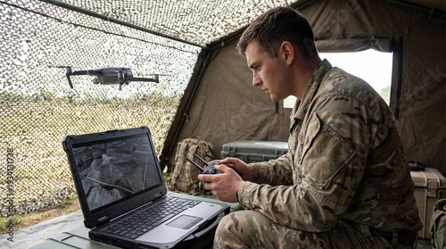 Vigilant operator directs an unmanned aerial vehicle above the tactical terrain, enhancing situational awareness from a mobile command tent