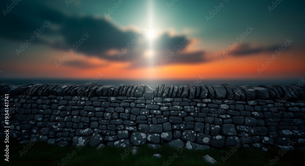 Obraz premium Stone wall at sunset with sun shining through clouds