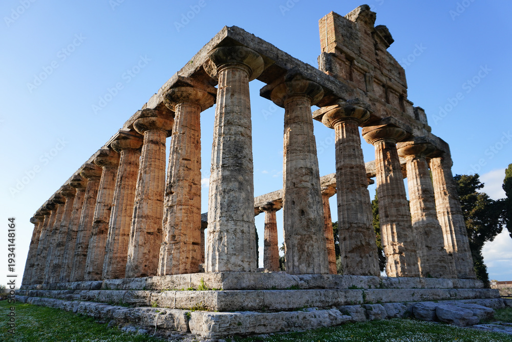 Fototapeta premium Ancient Greek Temple of Athena or Temple of Ceres. Ancient ruins. Paestum, Archaeological UNESCO World Heritage Site, Province of Salerno, Campania, Italy. 