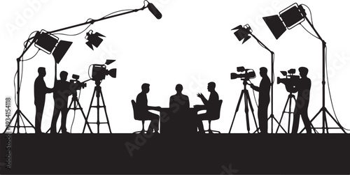 Crew recording interview with two people sitting at table