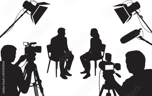 Silhouette of people being interviewed with camera and lights
