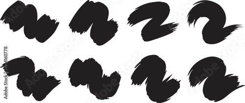 Abstract brush stroke patterns in black ink on a white background