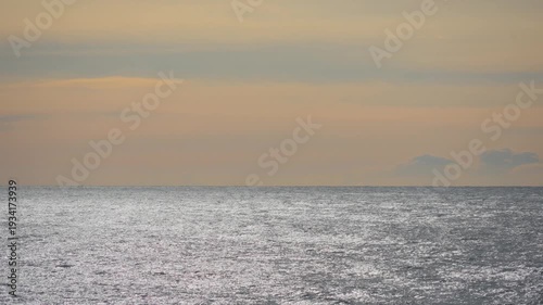 Golden hour sunlight reflecting on calm seascape