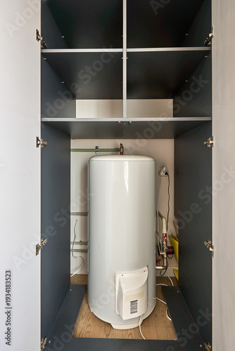 Water heater tank inside built in utility closet