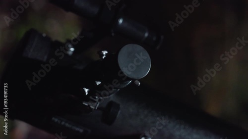 hands adjusting telescope eyepiece under night sky, cinematic closeup of fingers fitting eyepiece to scope, soft bokeh background, tripod and adjustment knob visible, quiet backyard atmosphere,