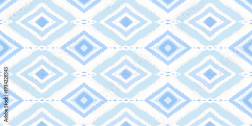 A seamless abstract vintage pattern featuring blue floral ornaments and geometric diamond elements in a retro textile style for elegant wallpaper or tile design