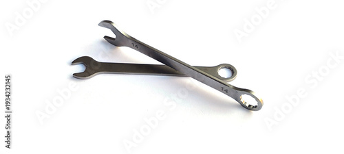 The combination wrenches made from materials steel. They feature an open-end on one side and a closed-loop end on the other.
