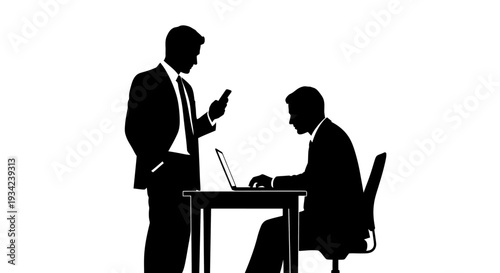 Two Businessmen Working Together at Desk.