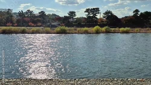 Uji city, Japan river flow in Autumn bright sunlight good weather