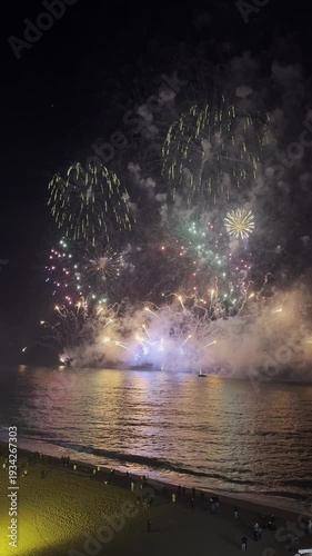 Spectacular fireworks burst in a kaleidoscope of colors against the darkened sky, captivating viewers during the local celebration. The explosions create a lively atmosphere filled with excitement.