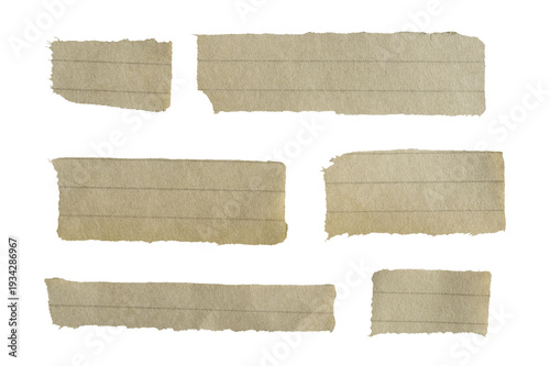 Torn old lined paper scraps with textured surface. Isolated