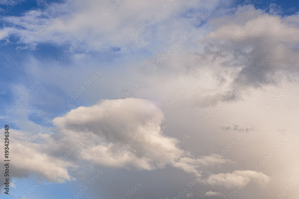 Fototapeta premium Dramatic cloudy sky with soft light and blue background