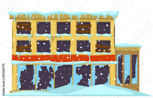 Abandoned building standing cold during winter snowstorm