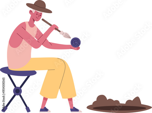 Artist painting spiral design on pottery object