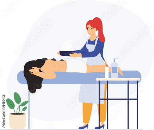 Woman enjoying hot stone therapy spa treatment