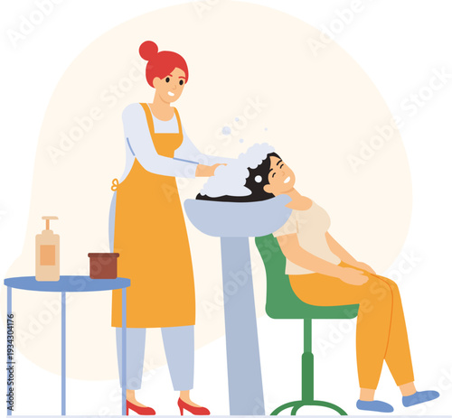 Hairstylist washing client hair in beauty salon